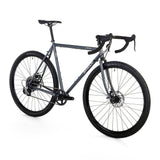 Surly Straggler 1x gravel bike with steel frame in dark blue, designed for commuting, touring, and gravel riding.