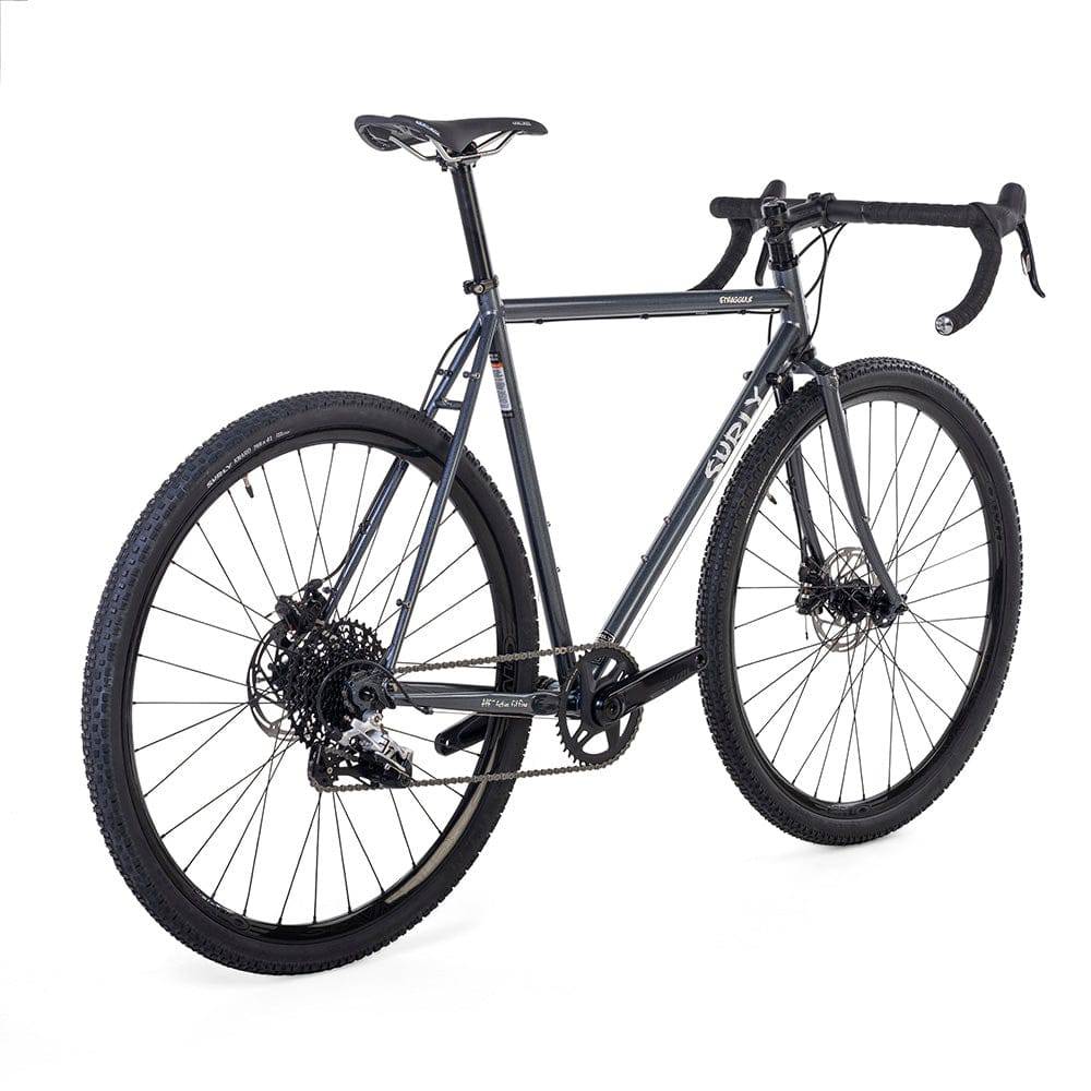 Surly Straggler 1x gravel bike with a dark blue steel frame, suitable for commuting, touring, and gravel riding.