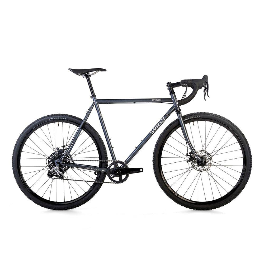 Surly Straggler 1x gravel bike with a steel frame in dark blue, designed for commuting, touring, and gravel riding.