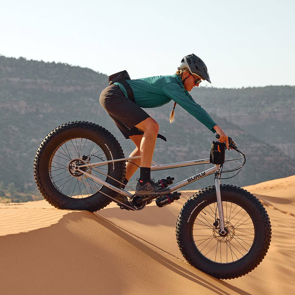 Surly Moonlander 2.0 fat bike with 9-speed Pinion gearbox and 24x6.25-inch fat tires, shown in gray color.