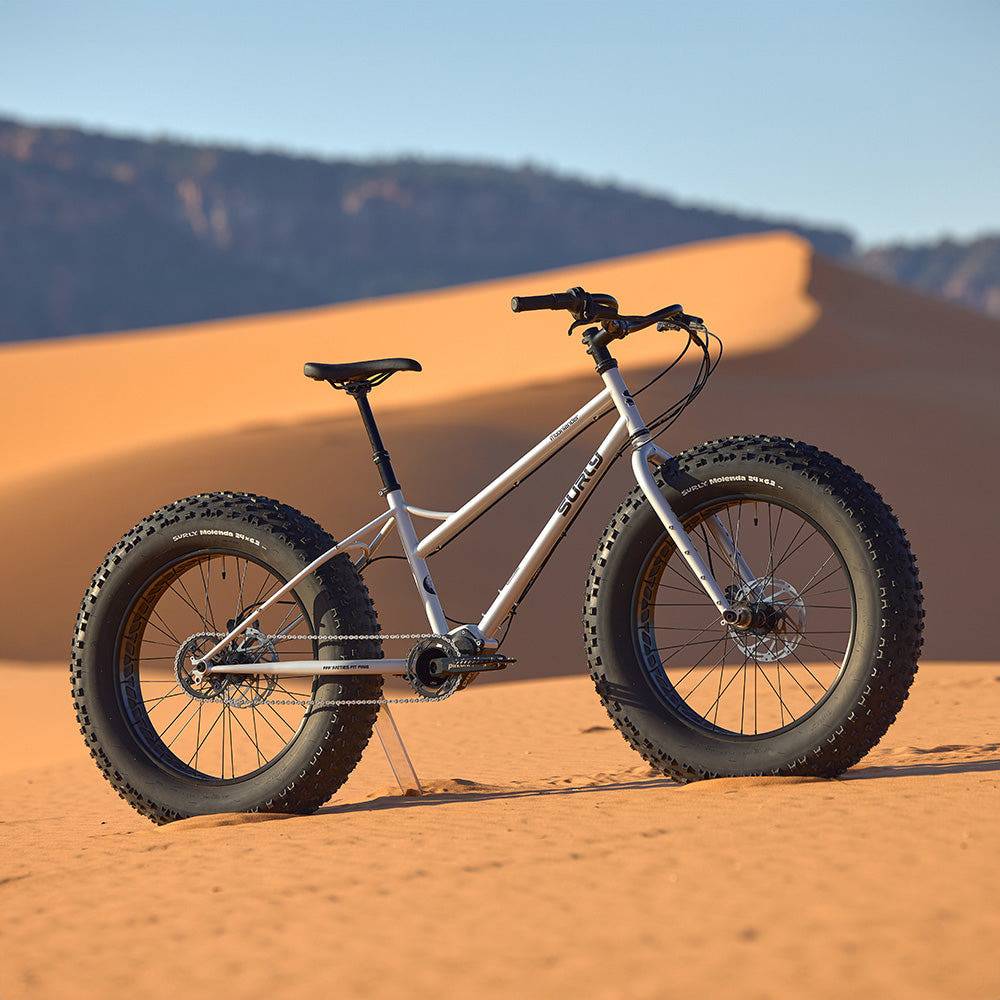 Surly Moonlander 2.0 fat bike with 9-speed Pinion gearbox, gray frame, and 24 x 6.25-inch fat tires, ready for off-road adventures