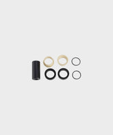 Fox rear shock mount hardware offset spacers with IGUS bushing for bike suspension components, showing close-up of spacers and bushings.