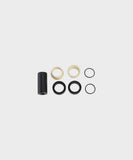 Fox rear shock mount hardware offset spacers with IGUS bushing for bike suspension components, showing close-up of spacers and bushings.