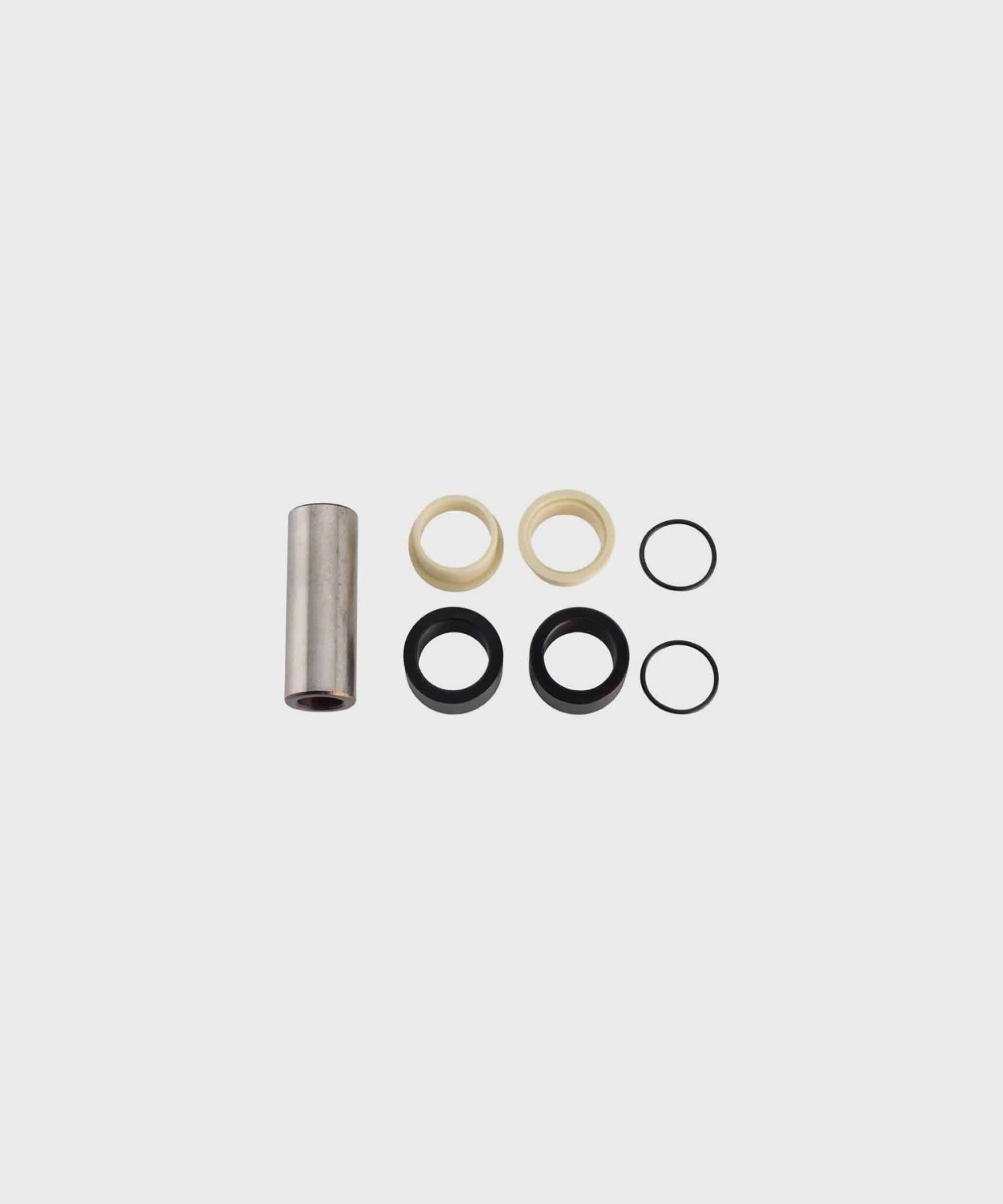 Stainless steel Fox rear shock mount hardware for bike suspension components, showing detailed mounting brackets and spacers.