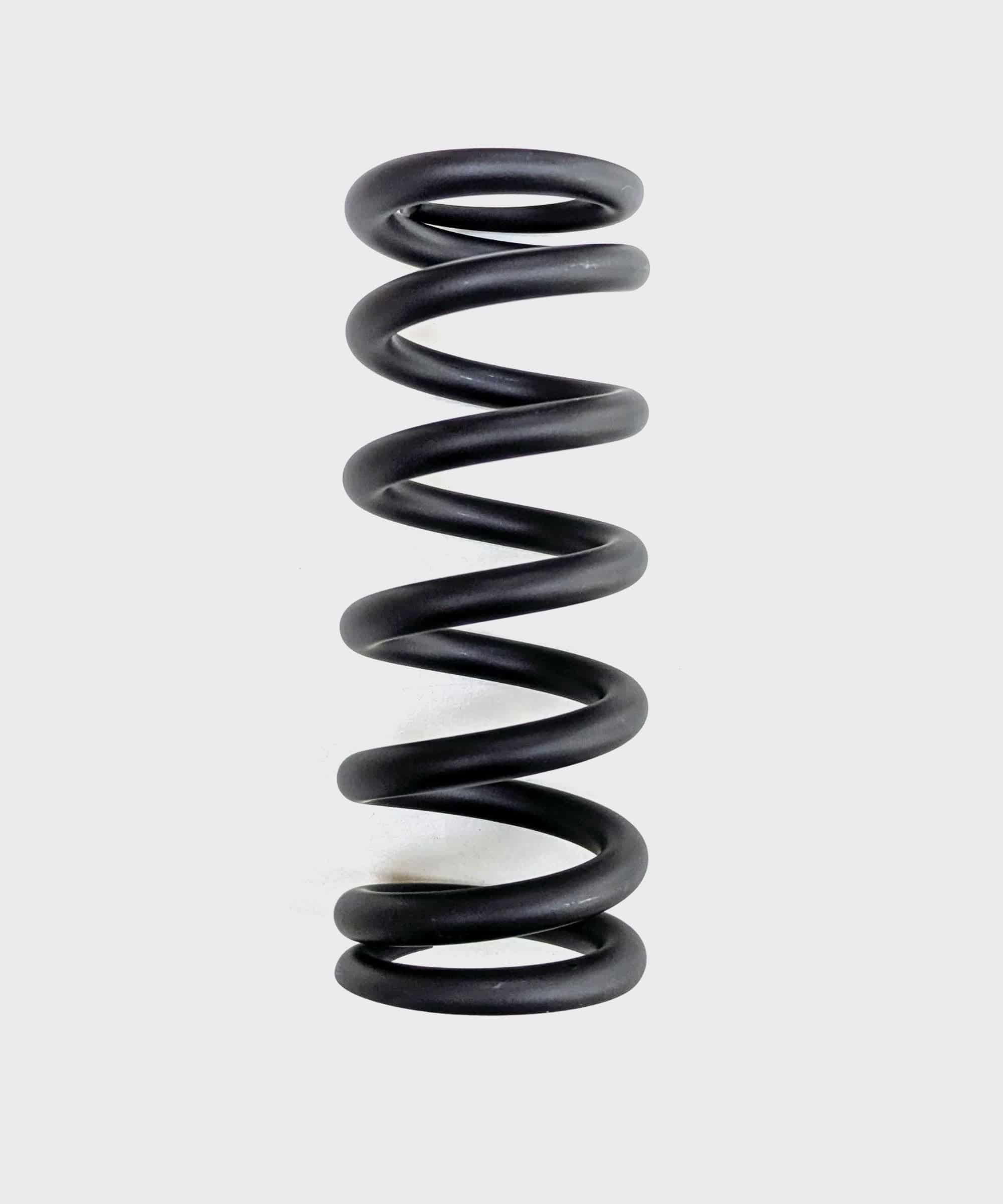 Fox SLS MTB rear shock spring with advanced surface treatment, durable metal component for mountain bike suspension.