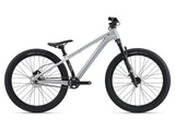 Giant STP 26 kids' bike for dirt jumps and trail riding, featuring a sturdy frame, knobby tires, and suspension for rough terrain.