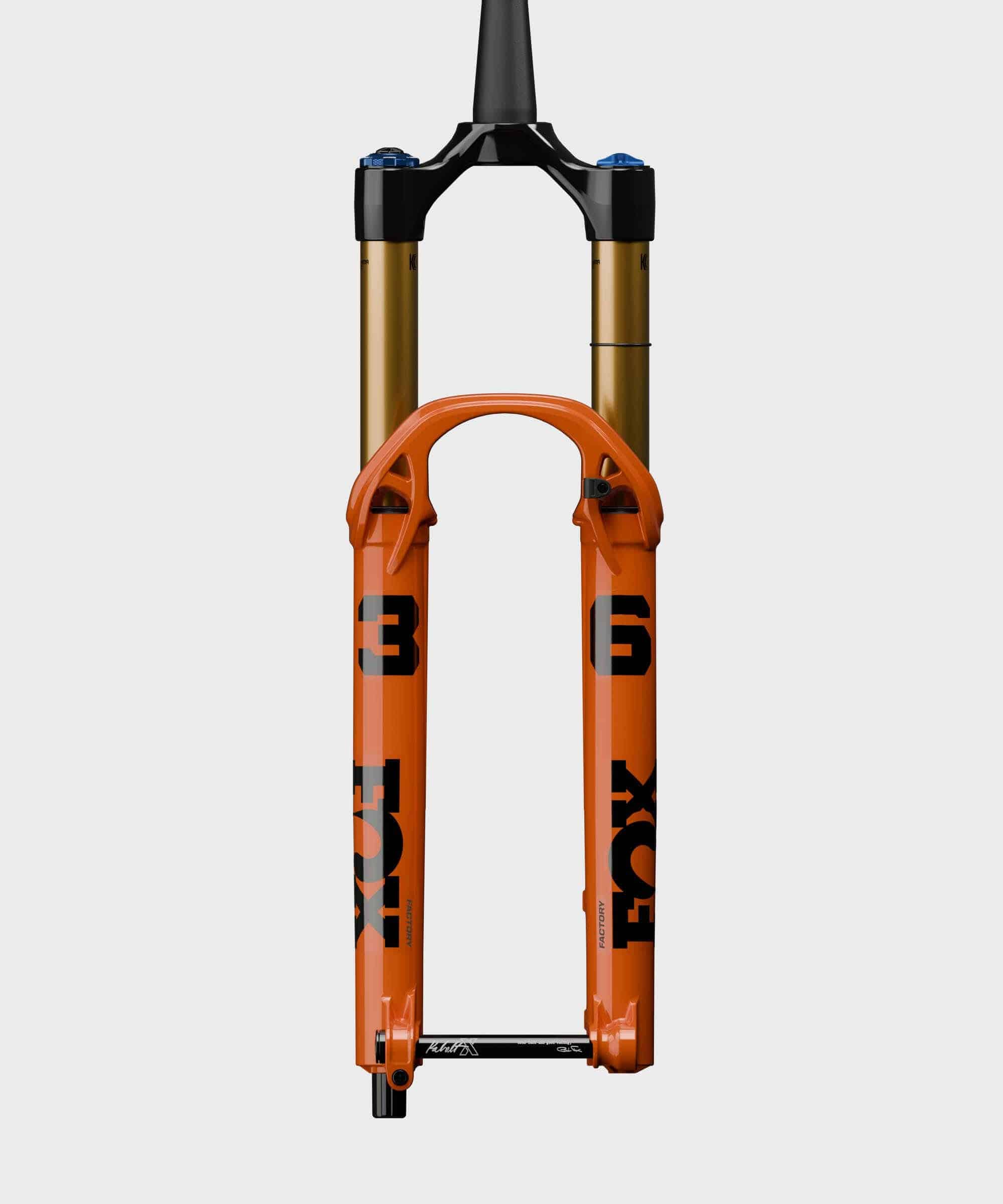 Fox 36 Float Factory GRIP X tapered fork for all-mountain suspension, showing the rugged black and gold design with stanchions and crown.