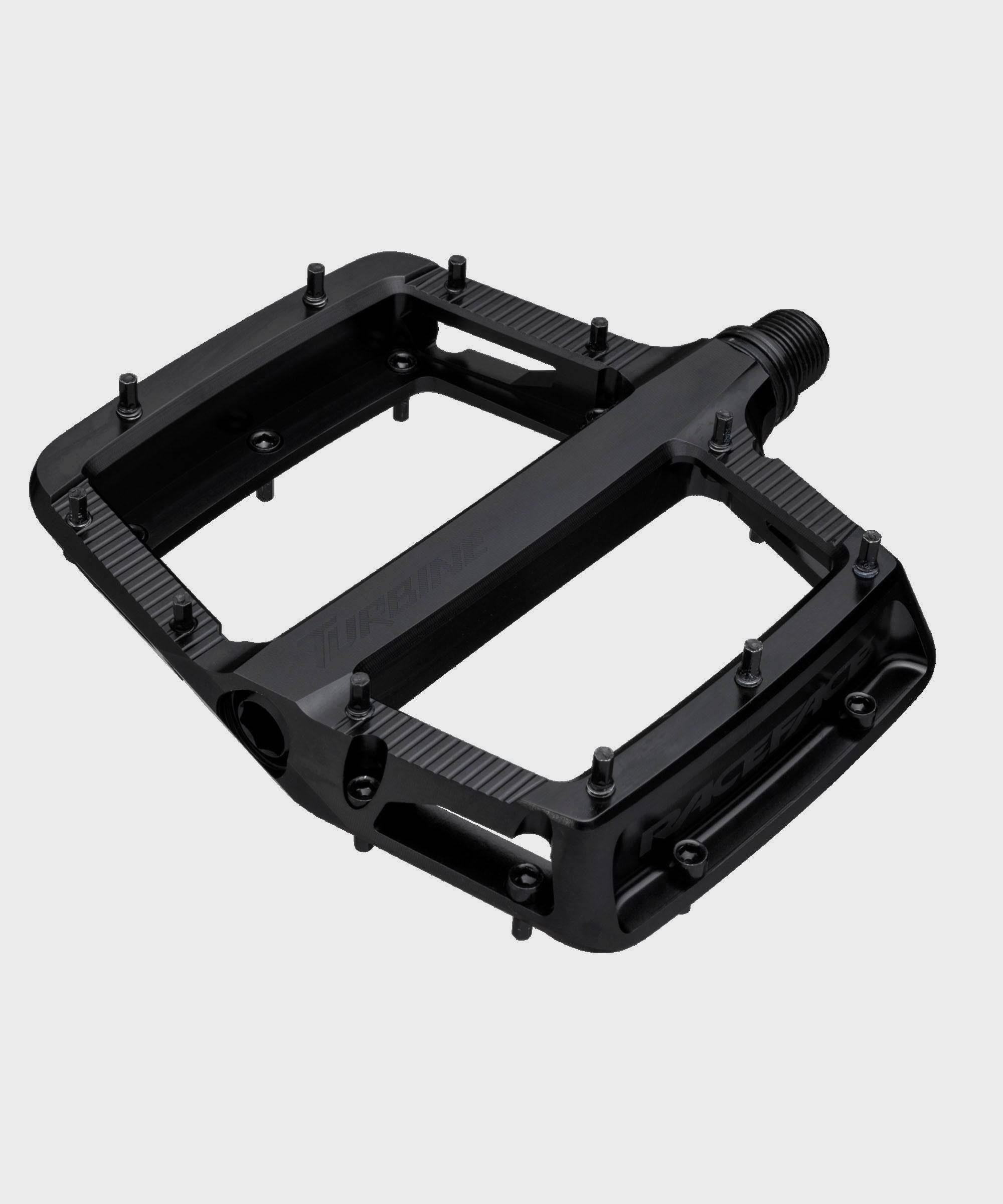 Race Face Turbine mountain bike pedals with adjustable pins for enhanced grip and durability, designed for off-road cycling.