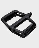 Race Face Turbine mountain bike pedals with adjustable pins for enhanced grip and durability, designed for off-road cycling.