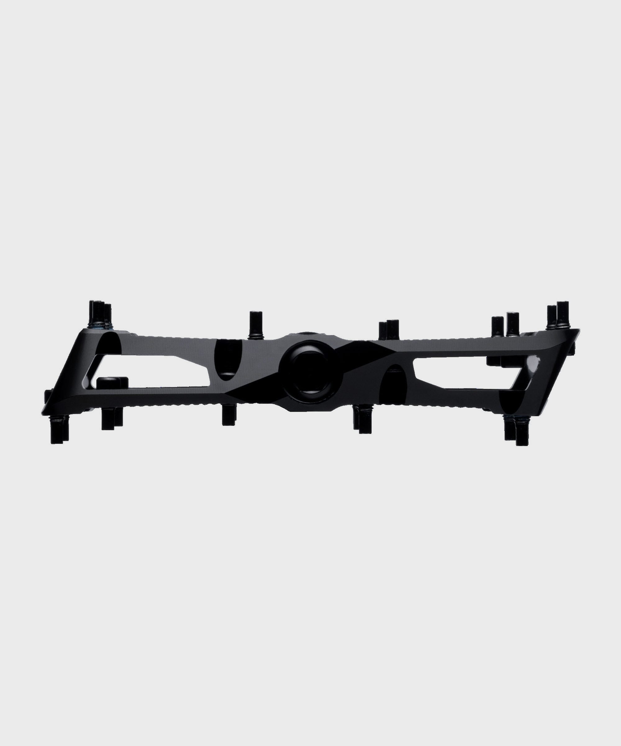 Race Face Turbine mountain bike pedals with adjustable pins for enhanced grip and durability, shown with a sleek black finish.