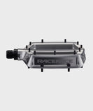 Race Face Turbine mountain bike pedals with adjustable pins for maximum grip, showcasing durable metal construction and pedal platform.