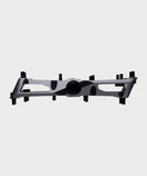 Race Face Turbine mountain bike pedals with adjustable pins for enhanced grip, shown with metal body and grip pins.