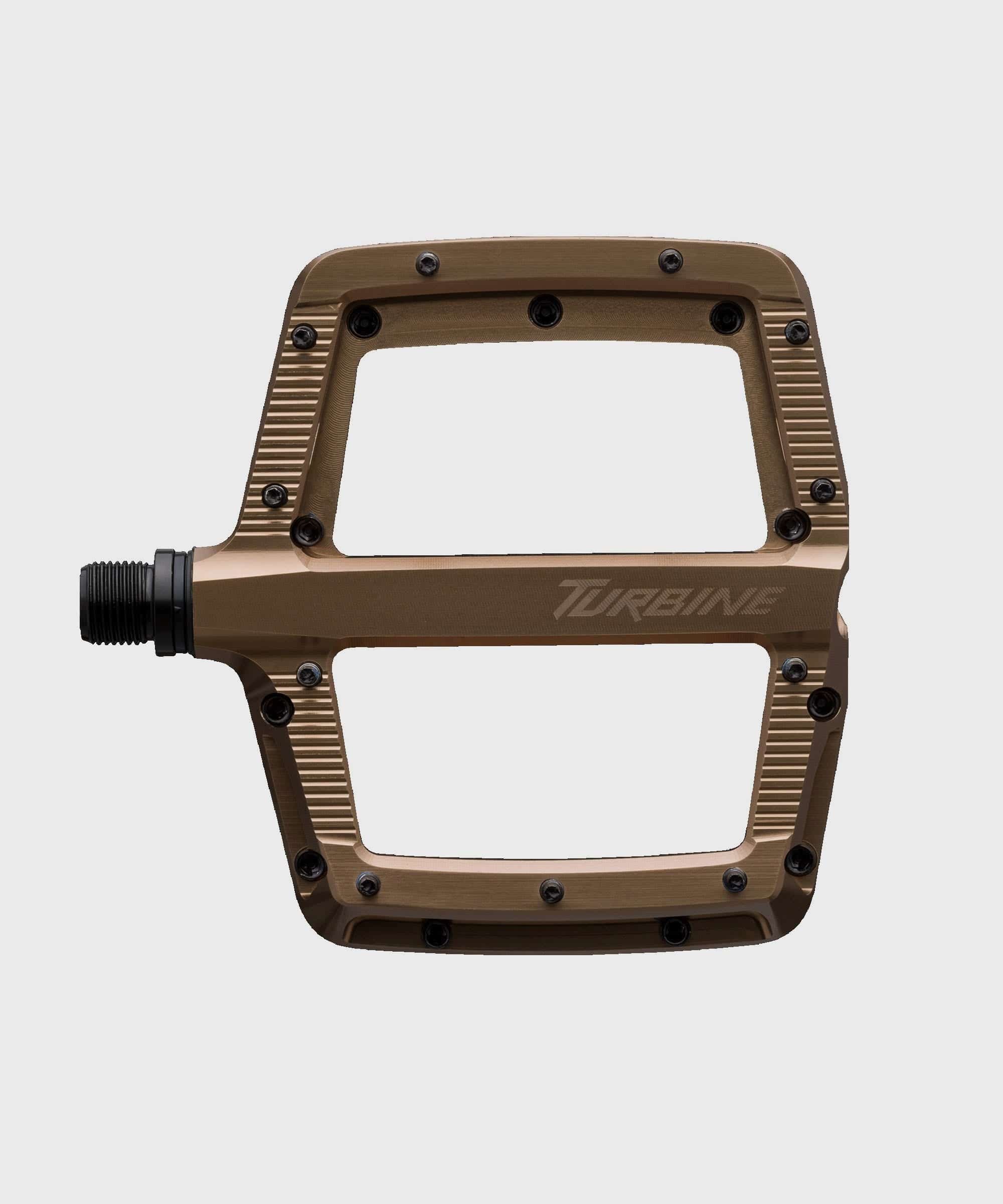 Race Face Turbine mountain bike pedals with adjustable pins for maximum grip, featuring durable aluminum construction and secure clip-in design.
