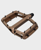 Race Face Turbine mountain bike pedals with adjustable pins for maximum grip, showcasing durable metal construction and textured surface.