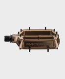 Race Face Turbine mountain bike pedals with adjustable pins for enhanced grip, featuring a durable metal body and clipless design.
