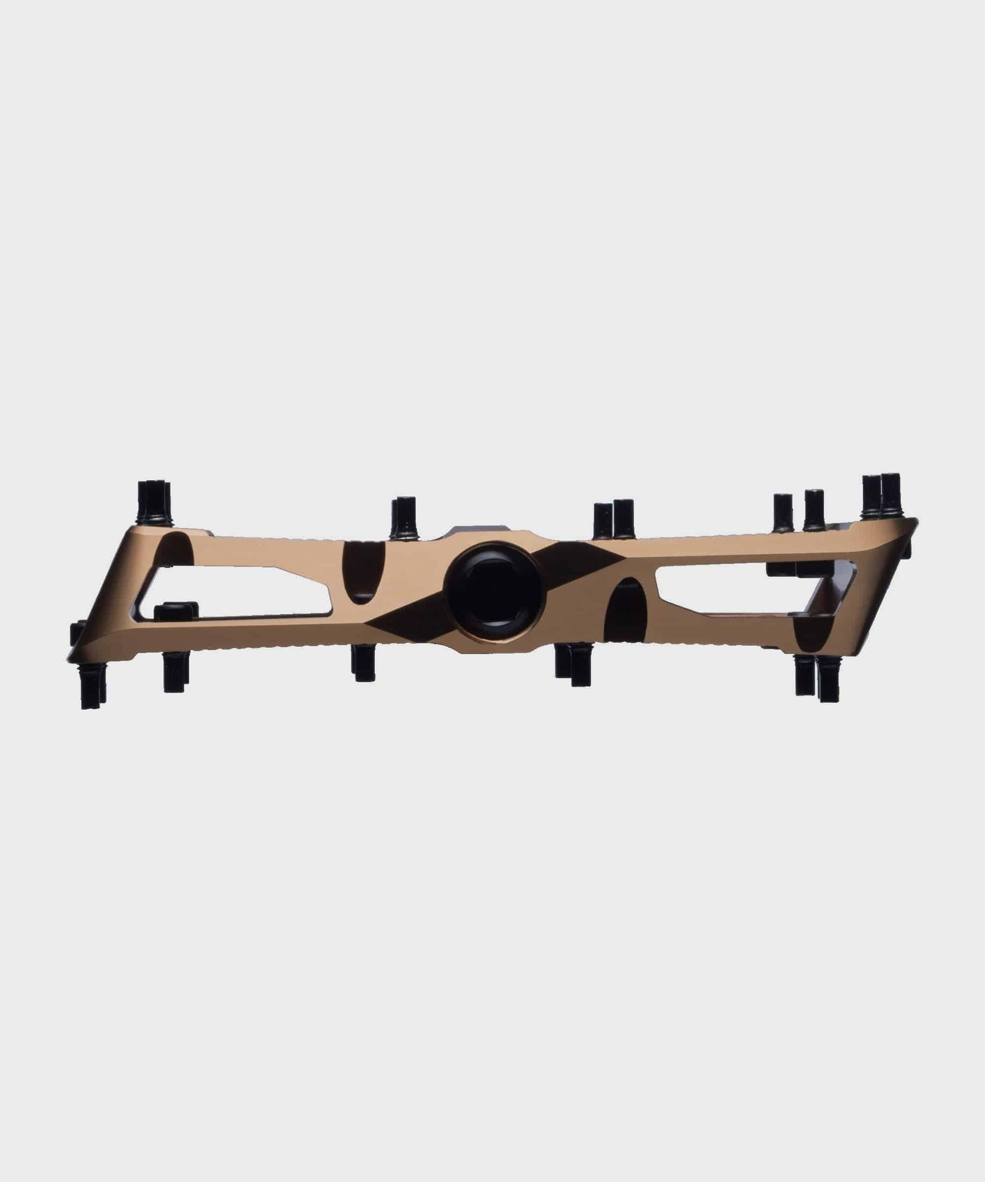 Race Face Turbine mountain bike pedals with adjustable pins for enhanced grip, shown with metal traction surface and clipless design.