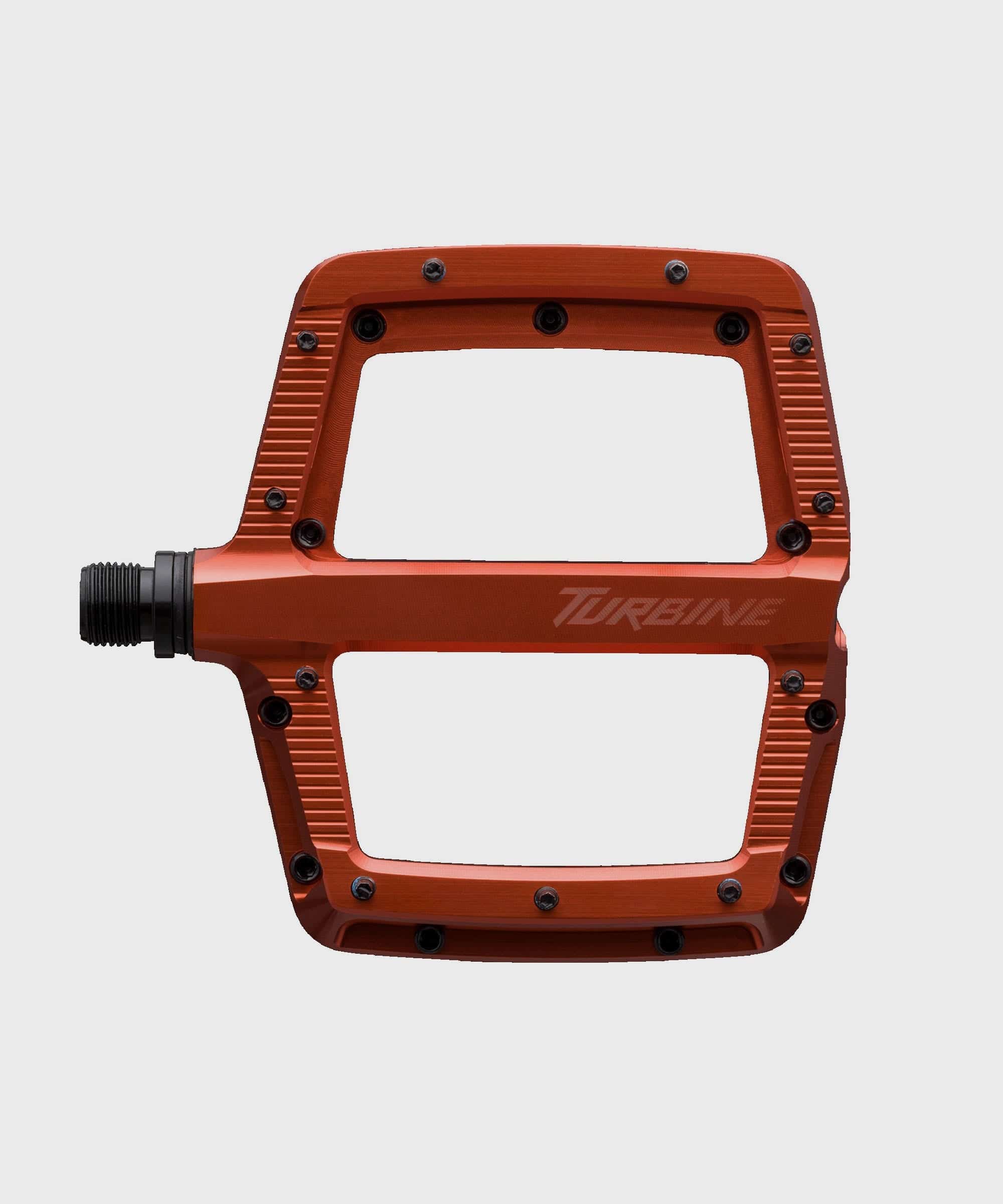 Race Face Turbine mountain bike pedals with adjustable pins for enhanced grip, showcasing sturdy aluminum body and sleek design.