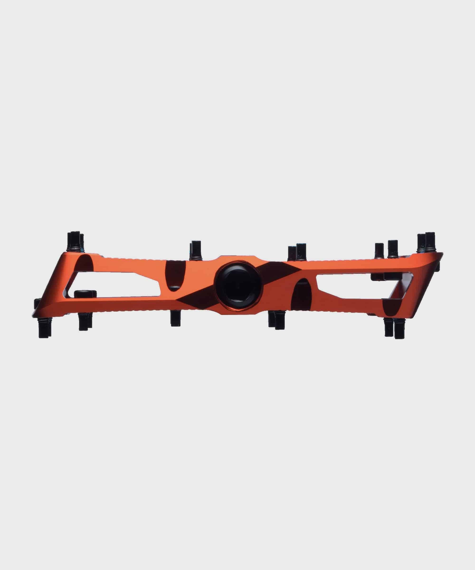 Race Face Turbine mountain bike pedals with adjustable pins for enhanced grip, showcasing durable metal components and sleek design.