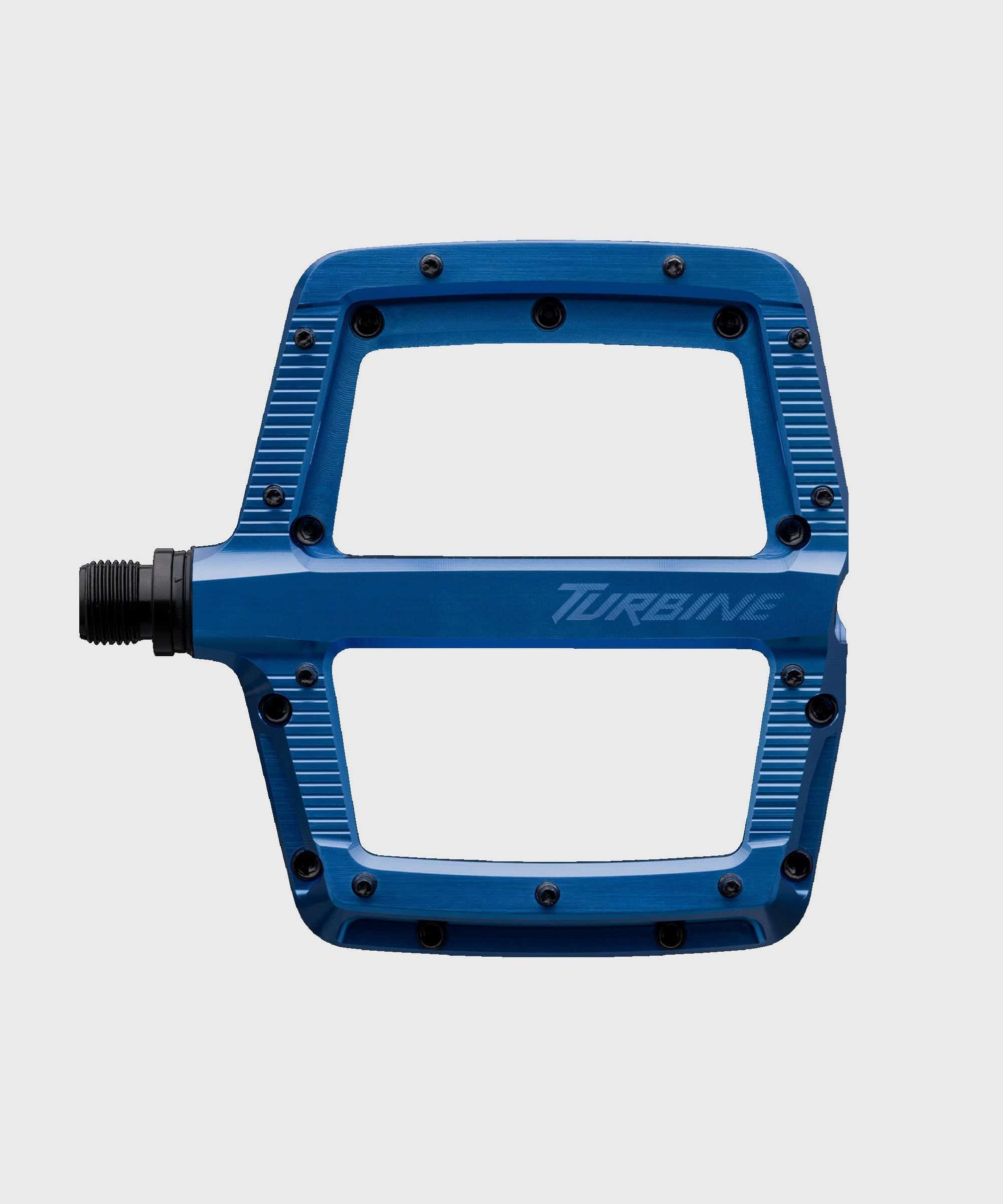 Race Face Turbine mountain bike pedals with adjustable pins for maximum grip, shown with a durable metal body and clipless design.