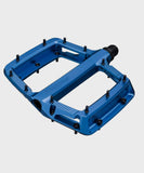 Race Face Turbine mountain bike pedals with adjustable pins for maximum grip, showcasing durable metal construction and grip-enhancing features.
