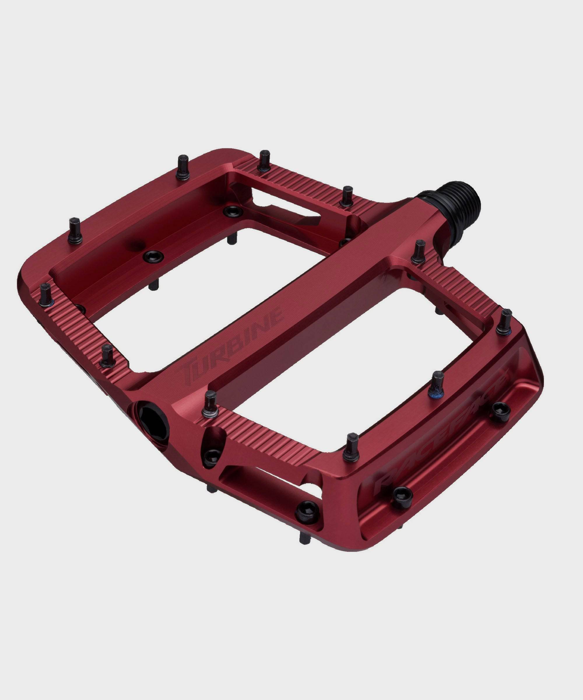 Race Face Turbine mountain bike pedals with adjustable pins for maximum grip, featuring durable metal construction and clipless design.