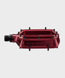 Race Face Turbine mountain bike pedals with adjustable pins for maximum grip, showcasing durable metal construction and grip-enhancing design.