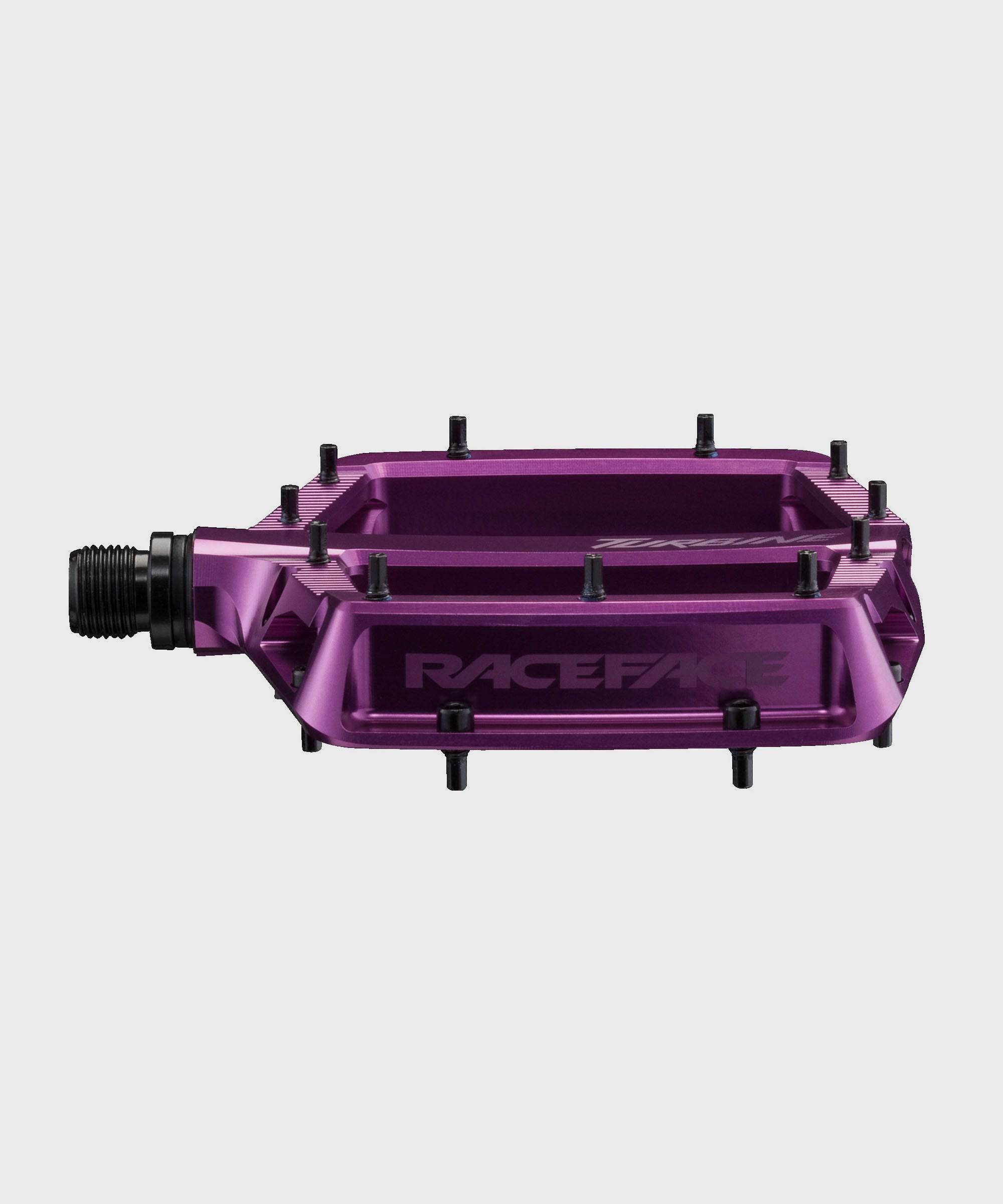 Race Face Turbine mountain bike pedals with adjustable pins for enhanced grip, featuring durable components for off-road cycling.