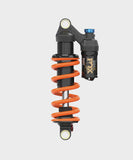 Fox DHX Factory 2-Position Adjustable Rear Shock Damper for coil suspension, showing the high-performance component with adjustment knobs.