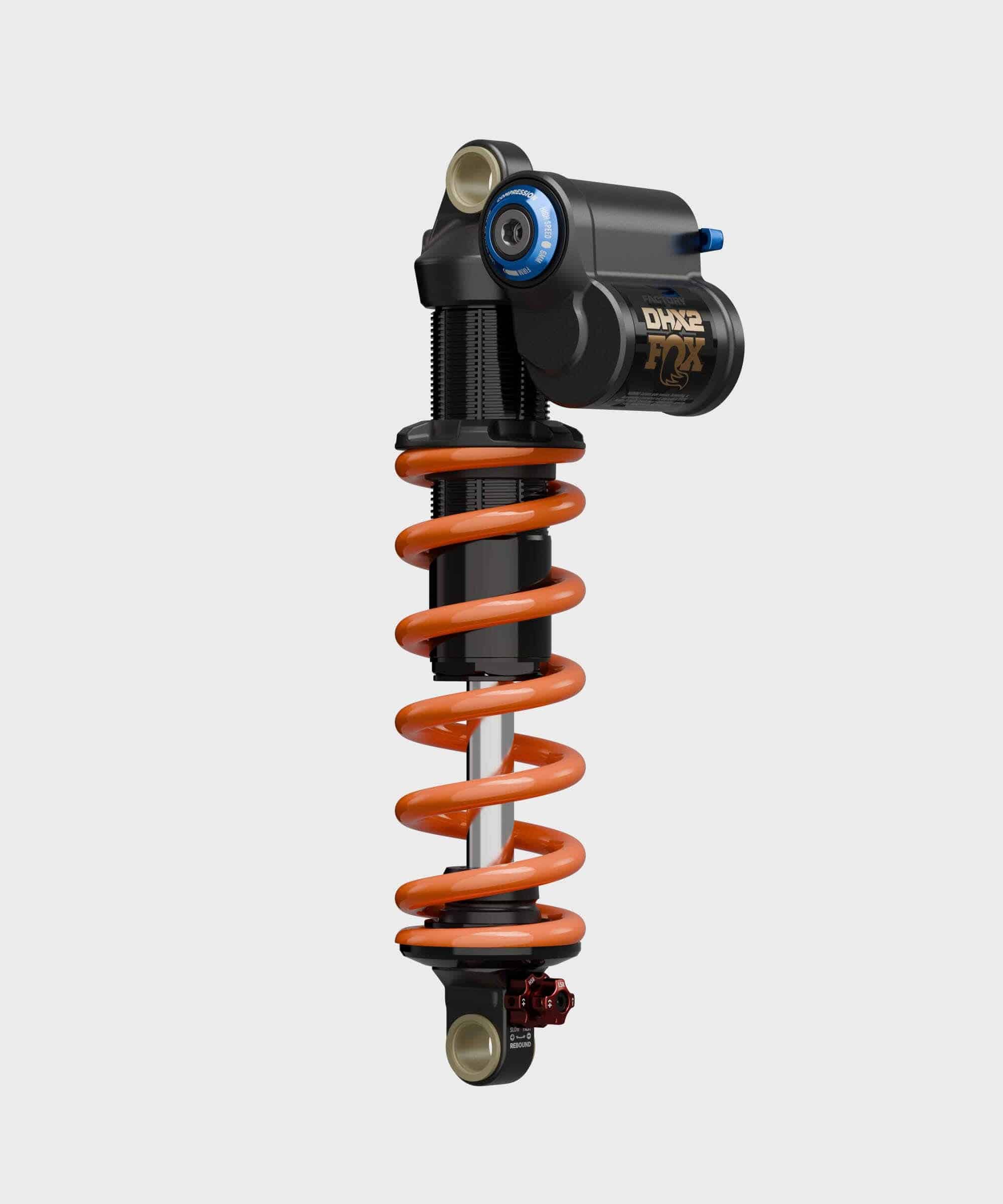 Fox DHX2 Factory mountain bike rear shock with 2-position adjustable damping, shown in a close-up of the high-performance component.