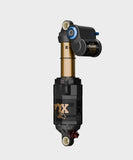Fox Float X2 Factory rear shock for mountain bikes, showing the adjustable dual-position component with blue and black accents.