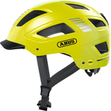 ABUS HYBAN 2.0 MIPS urban cycling helmet in signal yellow with ventilation and adjustable fit, designed for safe city riding.