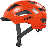 ABUS Hyban 2.0 urban cycling helmet in signal orange with ventilation and adjustable fit, designed for safe city riding.