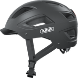 ABUS Hyban 2.0 urban cycling helmet with ventilation and adjustable fit, shown in metallic finish with multiple vents and strap adjustments.