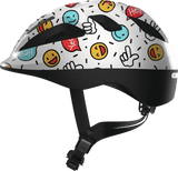 White ABUS SMOOTY 2.0 toddler helmet with smiley face design, designed for child seat cycling safety and comfort.
