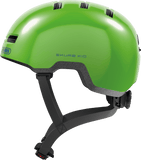 Shiny green ABUS Skurb kids helmet with adjustable straps for biking, skateboarding, and scooter riding.