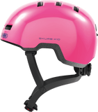 Pink ABUS Skurb kid helmet with adjustable straps, shiny finish, designed for biking, skateboarding, and scooting.