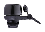 BBB-17 noisy brass bike bell with quick-release straps mounted on a bicycle handlebar, designed for all bike handlebars.
