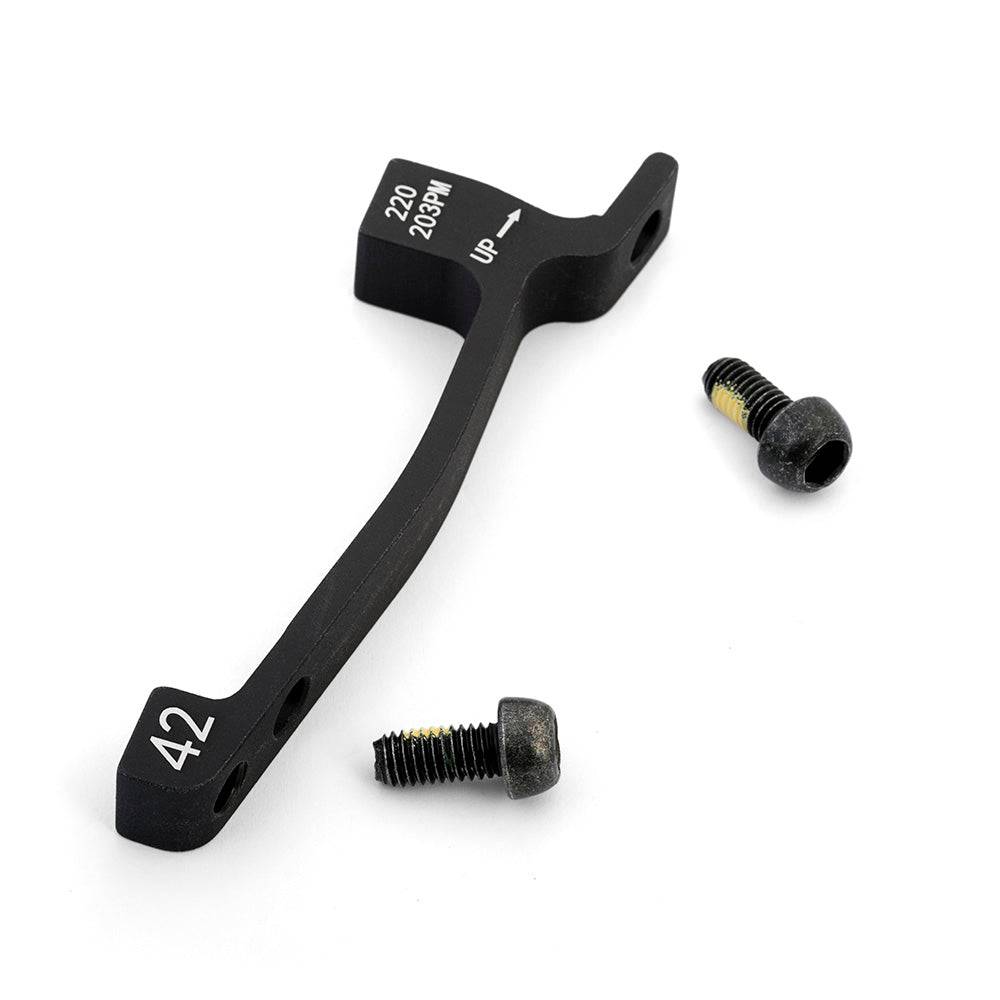 Hayes post mount brake adaptors for disc brake conversion, showing black metal components with mounting holes and brand markings.