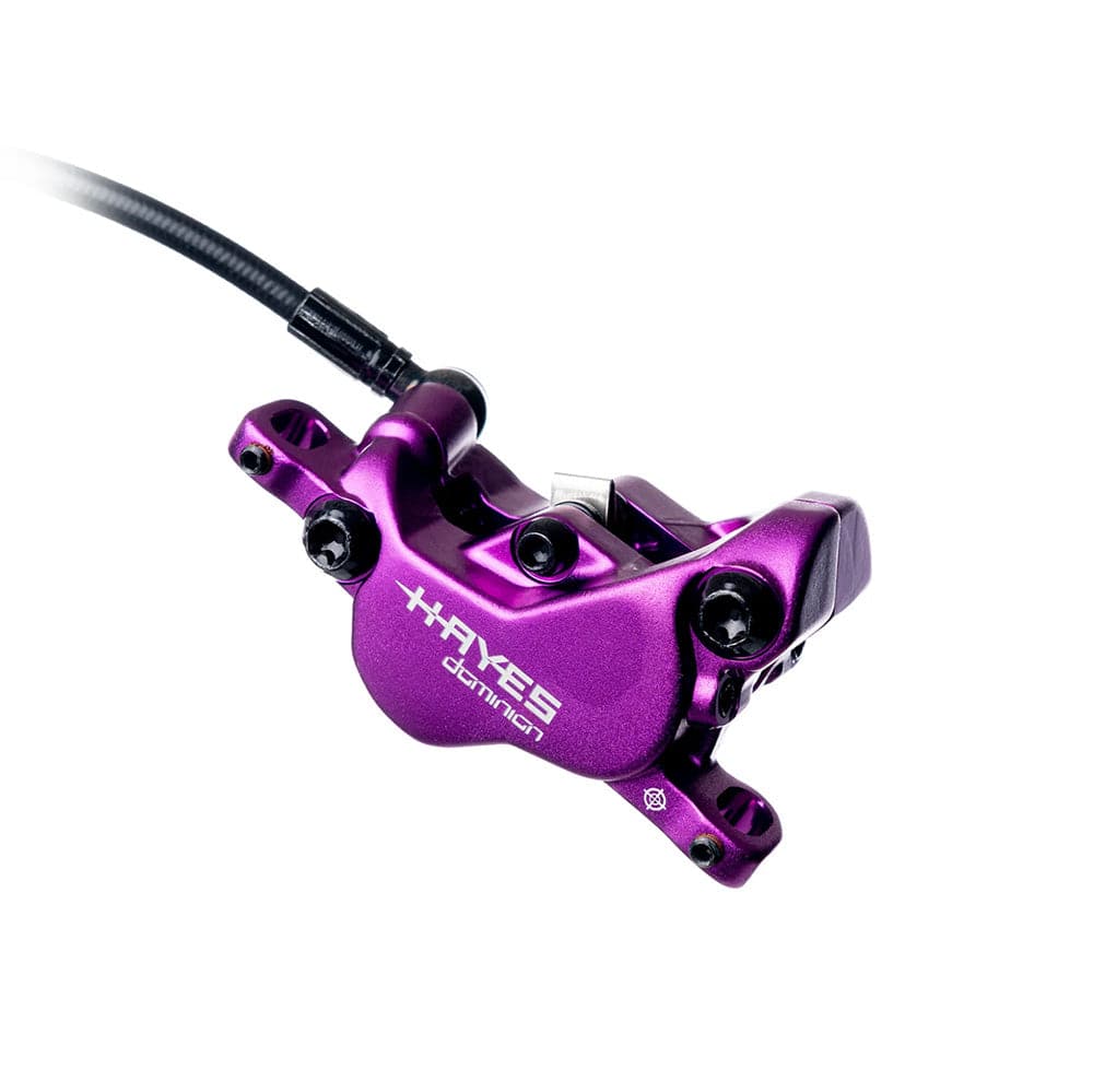 Hayes Dominion A4 4-piston disc brake caliper for high-performance bike braking systems, shown in a close-up view.