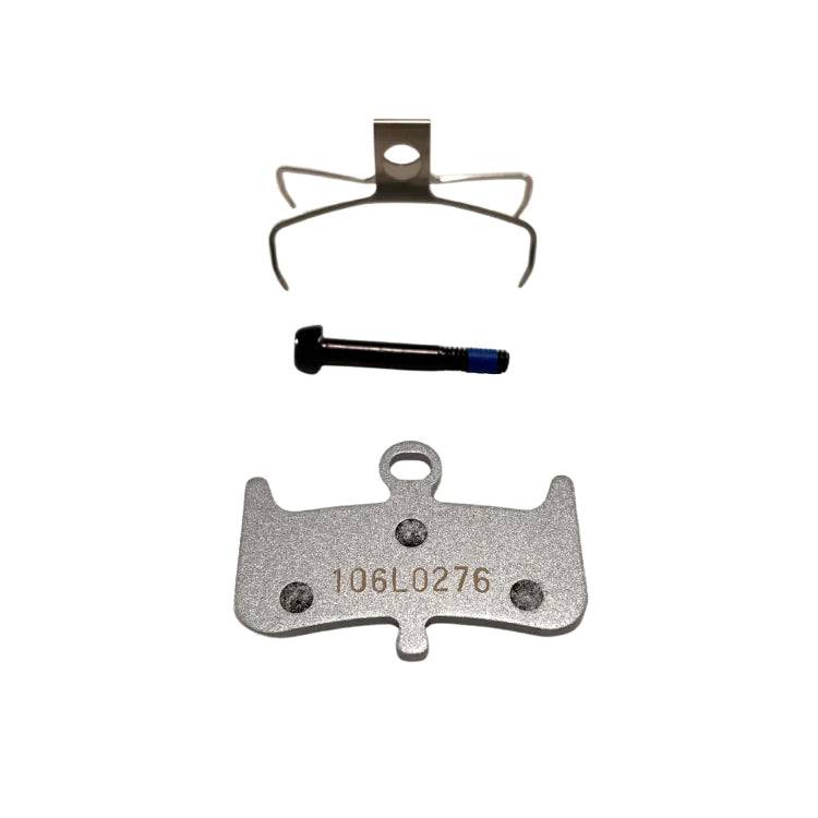 Hayes Dominion T4 semi-metallic brake pads for bicycle components, showing the brake pad set with detailed metal and rubber parts.