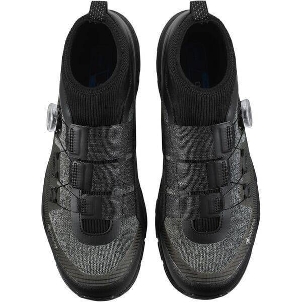Shimano EX7 GORE-TEX waterproof MTB shoes for mountain biking, showing the black, rugged footwear with Gore-Tex membrane and MTB design