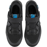 Shimano GE9 gravel shoes with BOA fit system and SPD cleat compatibility, shown in black with secure lacing and sole detail.