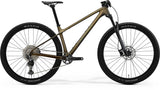 Merida Big Nine 3000 MY26 carbon frame 29er hardtail mountain bike with gold and green accents.