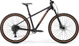 Merida Big Nine 40 mountain bike with black and red frame, durable aluminium hardtail, advanced geometry, and internal cable routing.