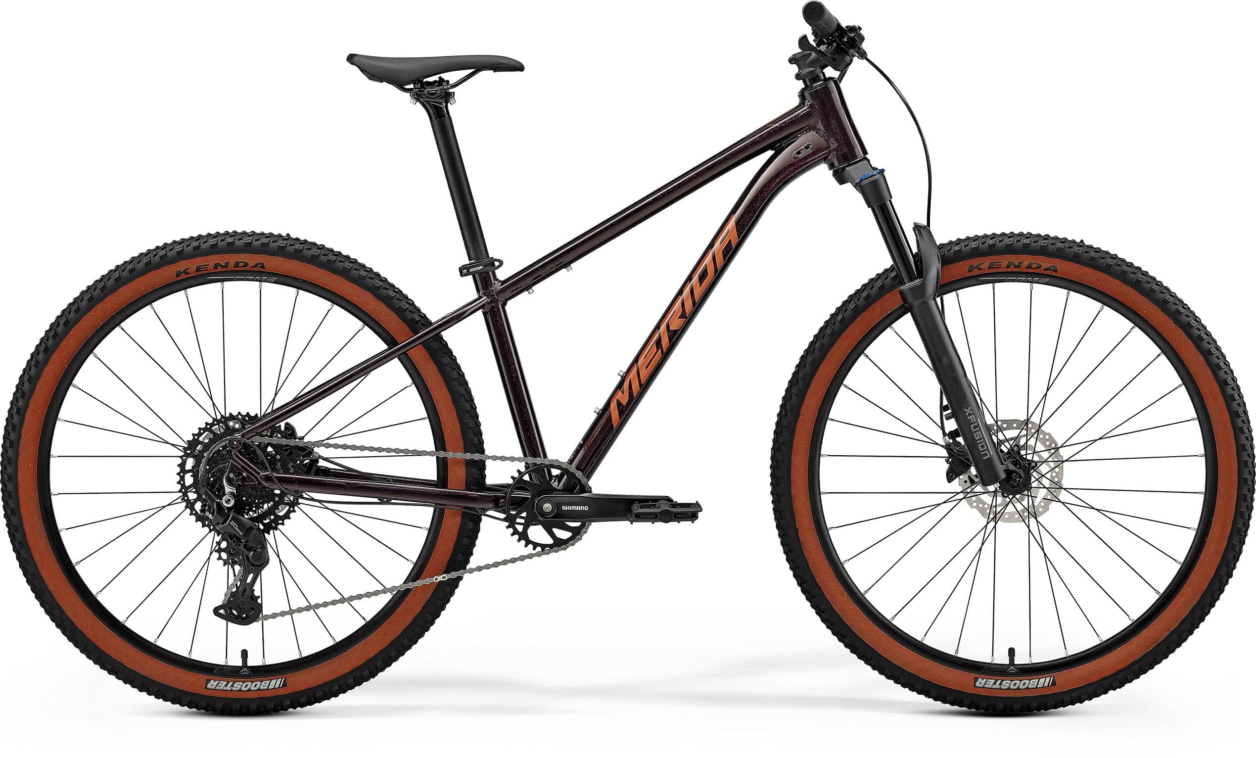 Merida Big Seven 40 MY26 aluminium hardtail mountain bike with Shimano drivetrain, black and red frame, outdoor riding scene