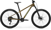 Merida Big Seven 60 MY26 aluminum hardtail mountain bike with modern geometry and green and gold frame in a scenic outdoor setting