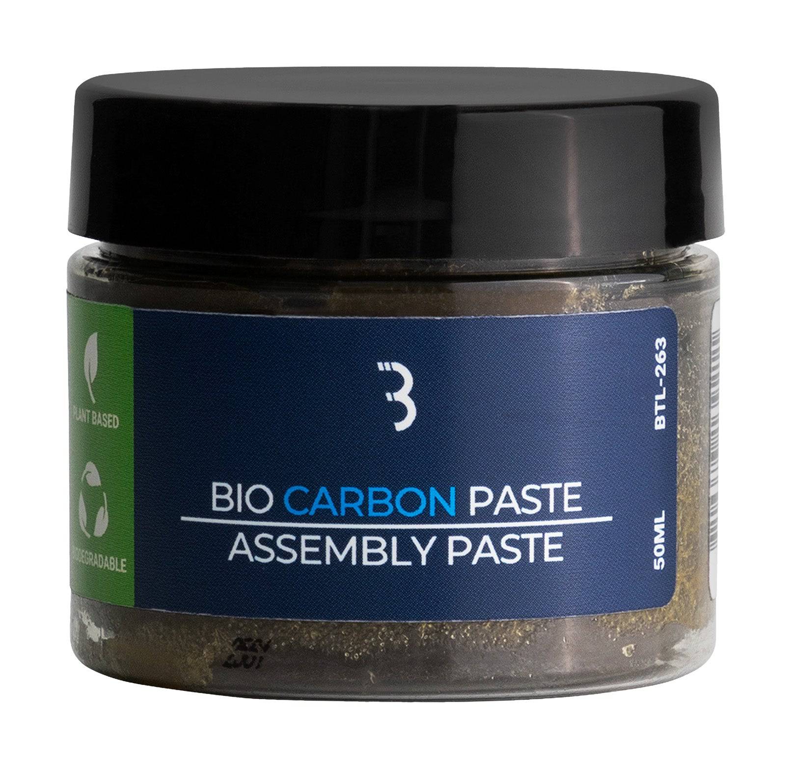 BBB BTL-263 BioCarbonPaste assembly paste for carbon bike components, 50ml, shown in a workshop setting with the paste container.