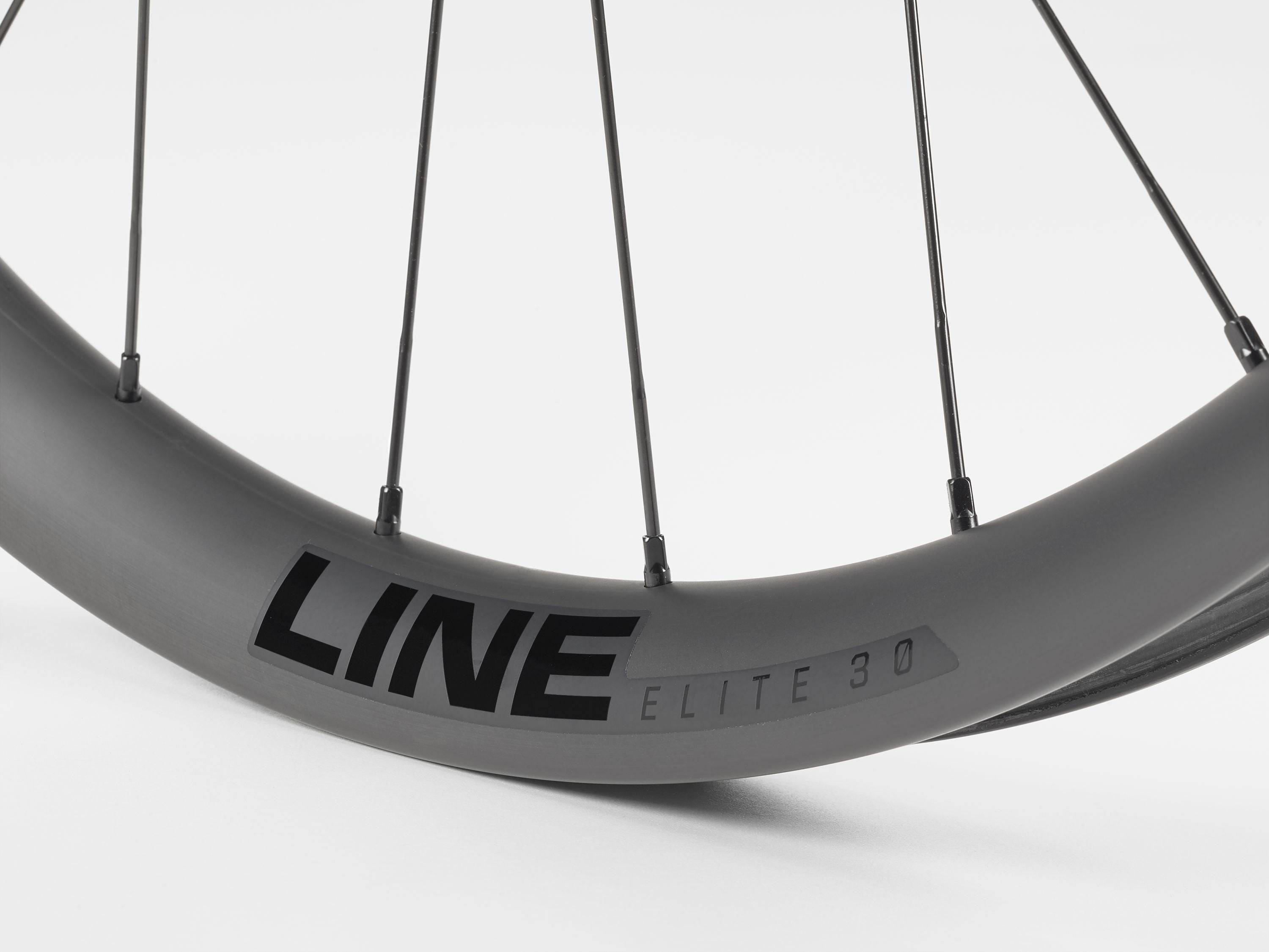 Black Bontrager Line Elite 30 TLR Boost 27.5 MTB front wheel with tubeless-ready rim and boost hub design.
