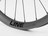 Black Bontrager Line Elite 30 TLR Boost 27.5 MTB front wheel with tubeless-ready rim and boost hub design.