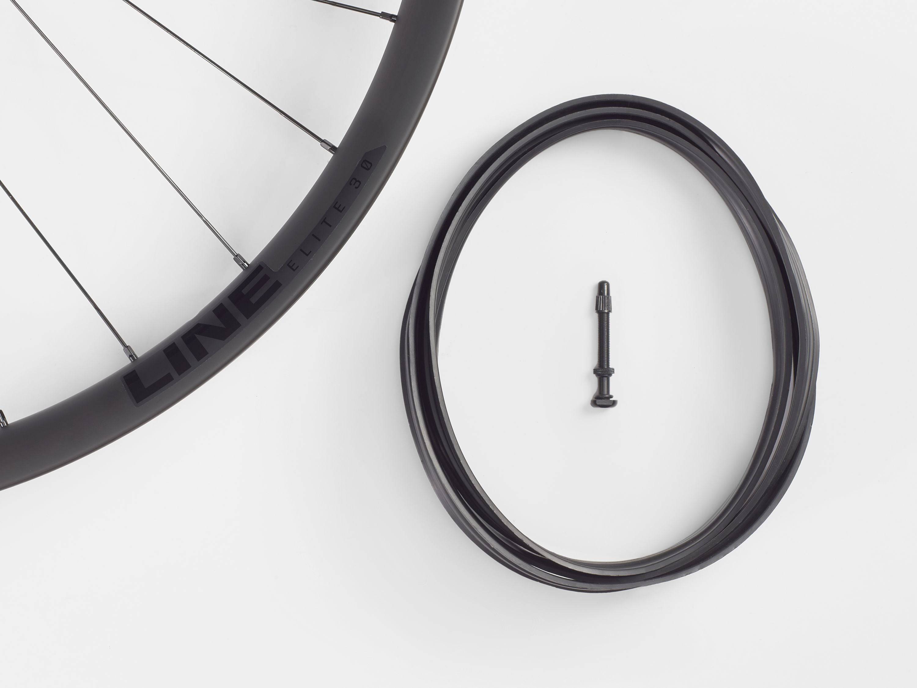 Bontrager Line Elite 30 TLR Boost 27.5 MTB front wheel in black, showcasing tubeless-ready rim and boost hub design.